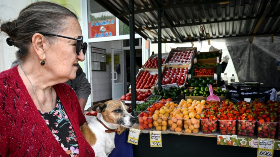 Russia cuts key interest rate, warns of tepid growth